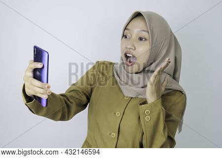 Shock Government Worker Women When Video Call Using A Smartphone. Pns Wearing Khaki Uniform.