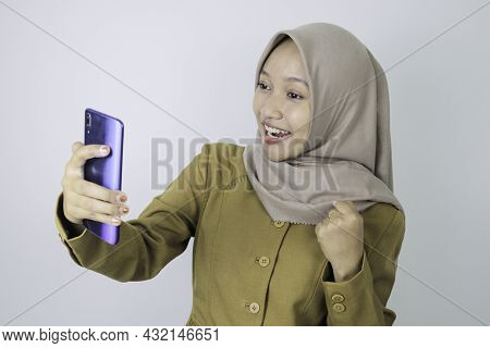 Smile Government Worker Women When Video Call Using A Smartphone. Pns Wearing Khaki Uniform.