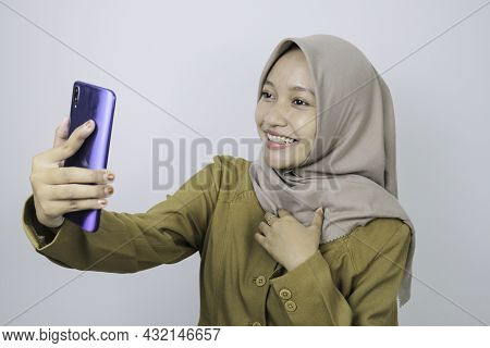 Smile Government Worker Women When Video Call Using A Smartphone. Pns Wearing Khaki Uniform.