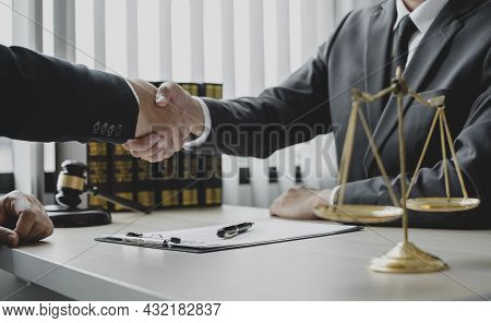 Shake Hand Professional Man Lawyers Work At A Law Office There Are Scales, Scales Of Justice, Judges
