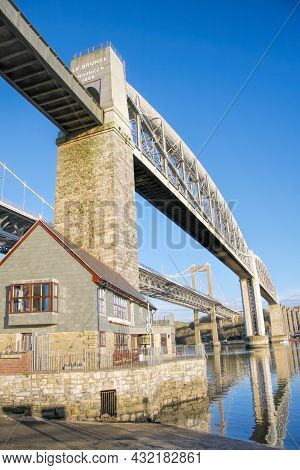 The Tamar Bridge (road) With The Royal Albert Bridge (railway) Crossing The Tamar River Between Corn