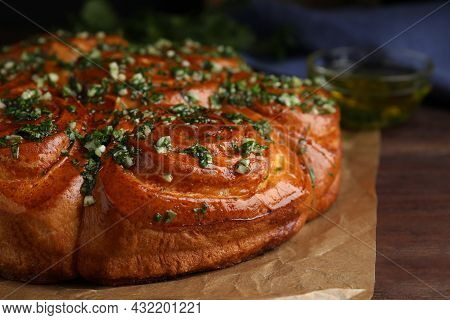 Traditional Ukrainian Garlic Bread With Herbs (pampushky) On Wooden Table, Closeup