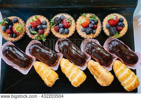 Assorted Cakes For The Holiday. Candy Bar. Sweet Birthday Treats.