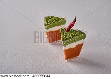 Verrine Mousse From Baked Pepper With Creamy Gorgonzola And Pesto In Transparent Buffet Shape Cup On