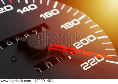 Car Speedometer. Auto Car Speedometer Shows 220 Km H Or Miles.closeup Shot,dark Black Background.aut