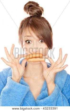 Woman with sausages simulating lip enhancement she's dreaming of filler injection