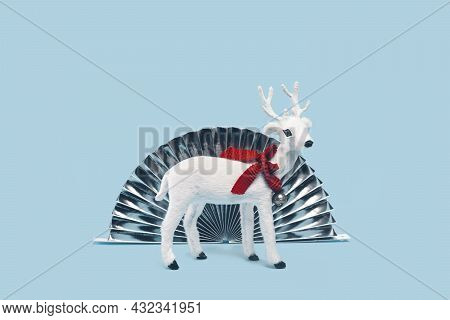 White Toy Reindeer On Christmas Red Background
