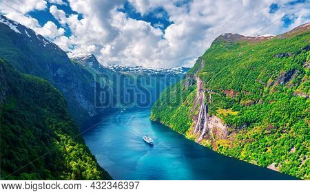 Panorama of breathtaking view of Sunnylvsfjorden fjord and famous Seven Sisters waterfalls, near Geiranger village in western Norway. Landscape photography