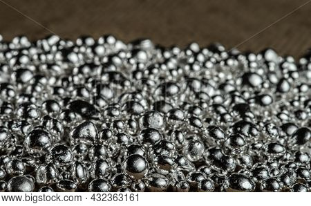 Pure Silver Granule Texture. Background From Silver Pellets. Selective Focus.