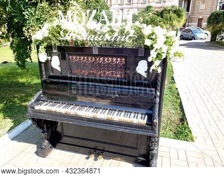 The Old Part Of Odessa City. Odessa Opera House View. The Old Piano With Summer Flowers On It. Odess