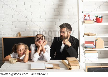 Little School Girl And Fether Teacher With Hold A Books With School Bag Is Back To School, Empty Spa