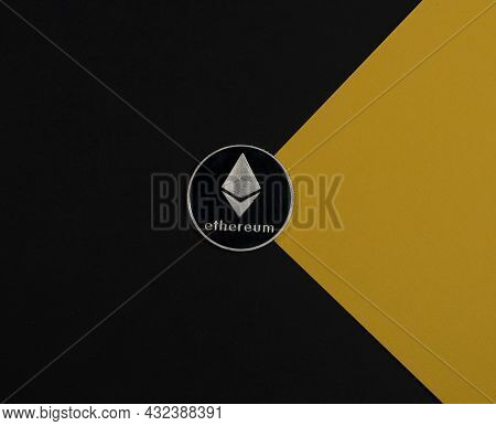 Ethereum Or Eth Silver Coin On Black And Yellow Background. Cryptocurrency And Crypto Concept Of Eth
