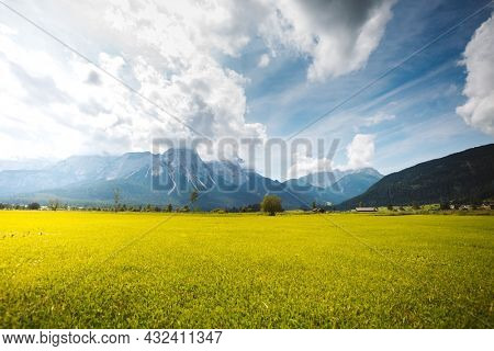 Perfect green golf course in Lermoos village. Location Austrian Alps, Tyrol, Reutte district, Austria, Europe. Summer trip to exotic places. Vibrant photo wallpaper. Discover the beauty of earth.
