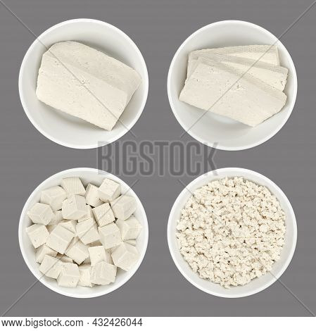 Processed White Tofu, In White Bowls, Isolated On Gray Background. A Block, Slices,  Cubes, And Crum