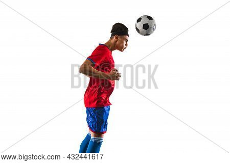 Portrait Of One Male Soccer Football Player Kincking A Ball With Head On Grass Flooring White Backgr