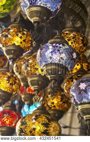 Middle Eastern Lambas Of Different Colors And Sizes Are Hanging In The Bazaar. Bright Traditional Ar