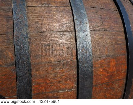A Traditional Old Wooden Barrel With Curved Walls And Metal Hoops. Dishes For The Ripening Of Alcoho