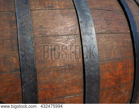A Traditional Old Wooden Barrel With Curved Walls And Metal Hoops. Dishes For The Ripening Of Alcoho