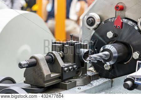 4 Flute Spiral Cutting Tool And Steel Tube Or Workpiece On Cnc Lathe Machine In Manufacturing Proces