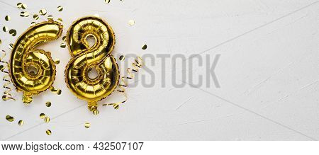 Golden Foil Balloon Number Sixty Eight. Birthday Or Anniversary Card With The Inscription 68. Gray C
