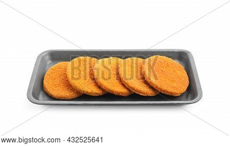 Uncooked Breaded Cutlets On White Background. Freshly Frozen Semi-finished Product