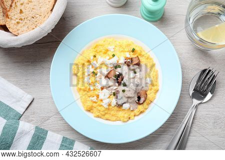 Tasty Banosh Served With Brynza And Mushrooms On Light Wooden Table, Flat Lay. Traditional Ukrainian