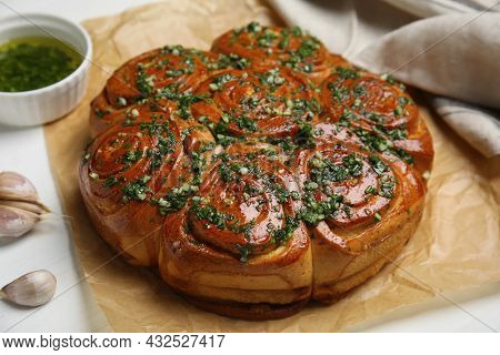 Traditional Ukrainian Garlic Bread With Herbs (pampushky) On White Wooden Table, Closeup