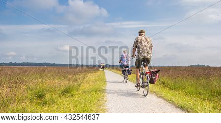 Dwingelderveld, Netherlands - August 21, 2021: Panorama Of People On Their Bicycles In National Park