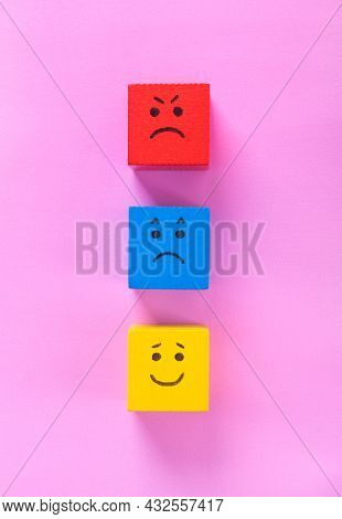 Red, Blue And Yellow Cubes With Cute Faces Depicting Human Emotions: Anger, Sadness And Happiness. C