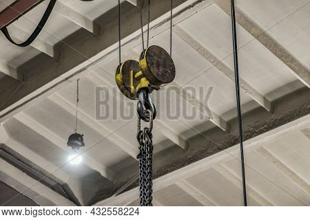 Hooking The Load With Chains For Lifting On A Telpher Crane.
