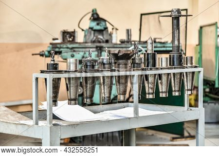 Taper Shank Mandrels With Cutters For Milling Machine On Rack.