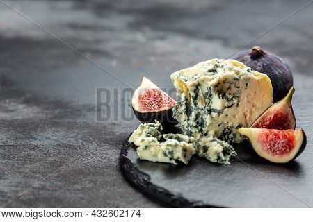 Blue Cheese And Sweet Fruit Figs. Blue Cheese Gorgonzola Picante With Blue Mold From North Of Italy.