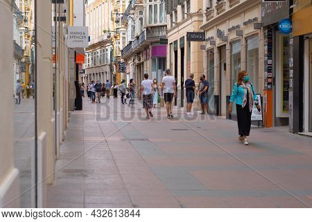 Málaga, Spain - June 19, 2021: People Walking In The Historic Center Of Malaga In Spain