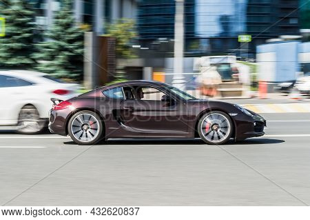 Porsche 718 Cayman Gts Is Third Generation Of The Porsche 982 Sports Car. Brown Premium Car In Motio
