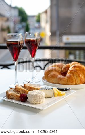 Drinking Of Kir Royal,  French Aperitif Cocktail Made  From Creme De Cassis Topped With Champagne, T