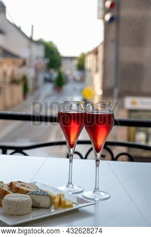Drinking Of Kir Royal,  French Aperitif Cocktail Made  From Creme De Cassis Topped With Champagne, T