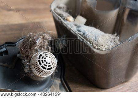 Dust Container In A Vacuum Cleaner With A Lot Of Dust. Dust Is The Cause Of Allergies And Feeling Un