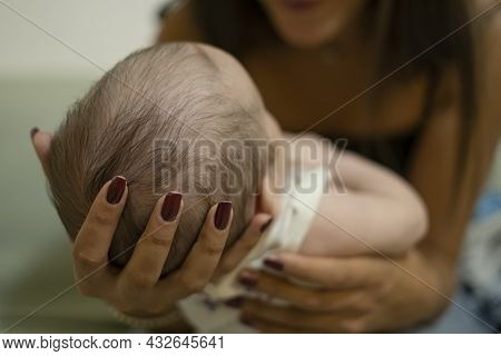 Young Mother Play With Adorable Newborn Child Boy, Family Love Concept Relationship
