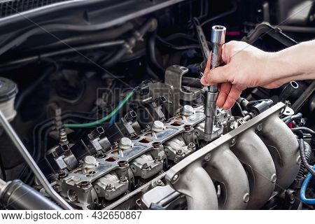 Hand A Man Checking Automobile Valve System  In The Engine Room Service Concept Of Car