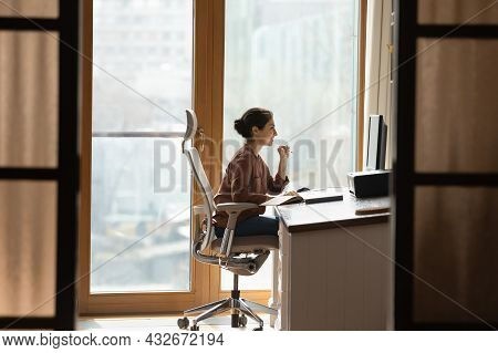 Indian Female Sit At Workplace On Ergonomic Chair Use Pc