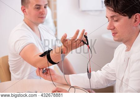 Patient Nerves Testing Using Electromyography At Medical Center