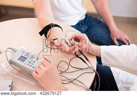 Patient Nerves Testing Using Electromyography At Medical Center