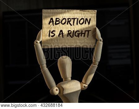 Abortion Is A Right Text On Placard In Hands.