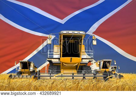 Four Orange Combine Harvesters On Grain Field With Flag Background, Novorossia Agriculture Concept -