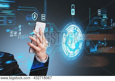 Businesswoman Wearing Formal Suit Is Holding Smartphone In Her Hand. Dark Blue Background. Digital I