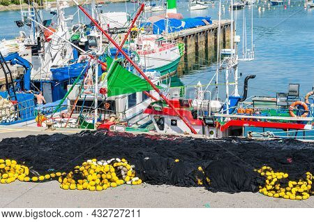 Santona, Spain - July 4, 2021: View Of Colorful Fishing Boats In The Port Of Santona, Cantabria, Nor