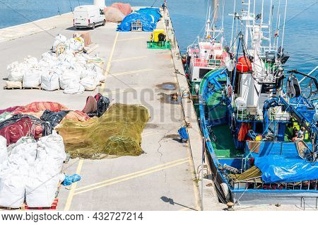 Santona, Spain - July 4, 2021: View Of Colorful Fishing Boats In The Port Of Santona, Cantabria, Nor