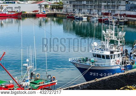 Santona, Spain - July 4, 2021: View Of Colorful Fishing Boats In The Port Of Santona, Cantabria, Nor