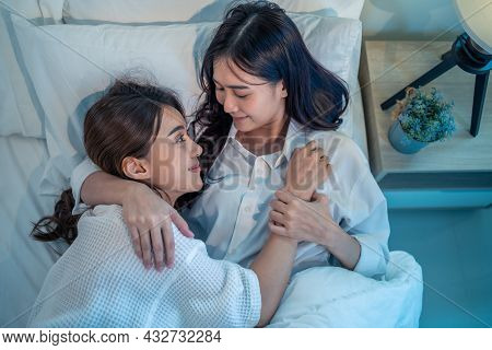 Asian Beautiful Lesbian Couple Lying Down On Bed And Hugging Each Other. Attractive Romantic Girl Fr