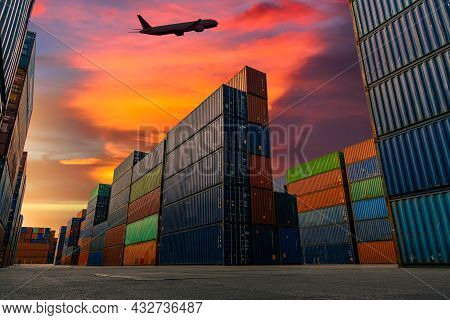 Transportation Logistics And Container Dock Cargo Yard And Cargo Plane Flying With Working Crane Bri